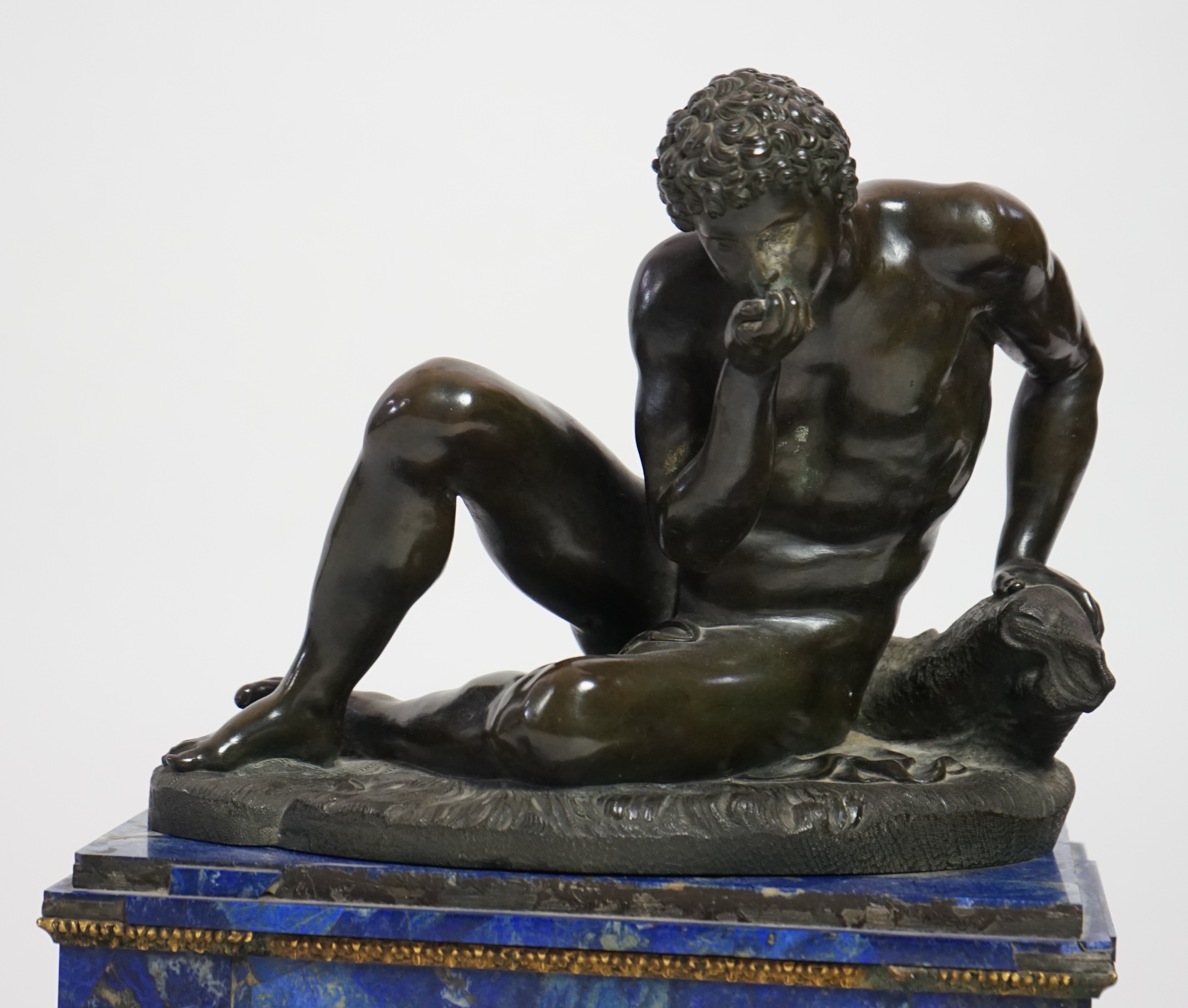 After the antique, a pair of late 18th/early 19th century Grand Tour souvenir bronze figures of seated warriors